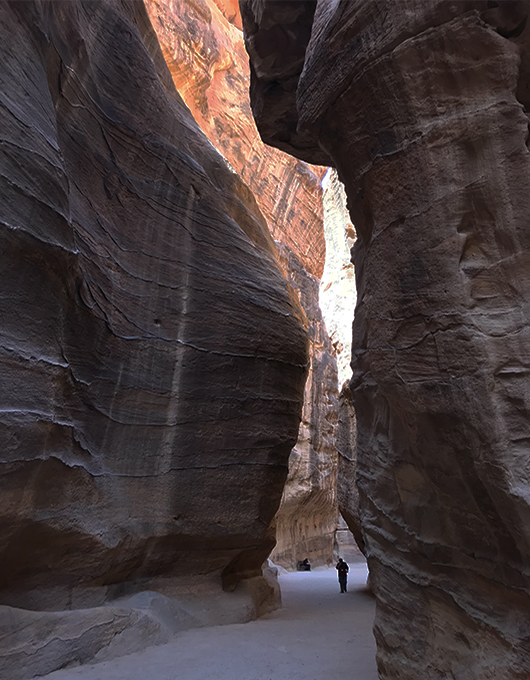 A tourist explores the site of Petra in Jordan 